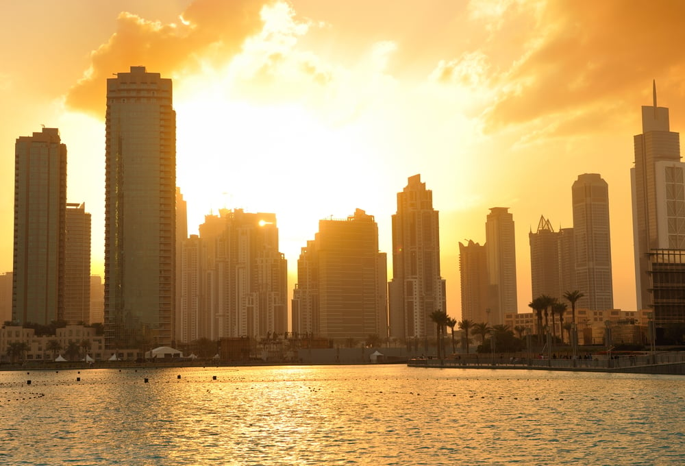 dubai city skyline at sunset conctruction and modern architecture concept